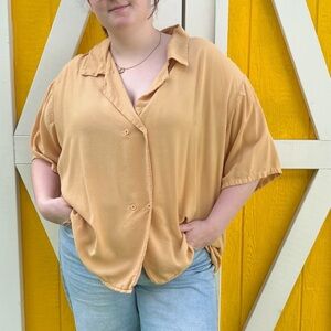 Yellow gold oversized short sleeve button up shirt.